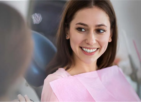 woman smiling in dental chair